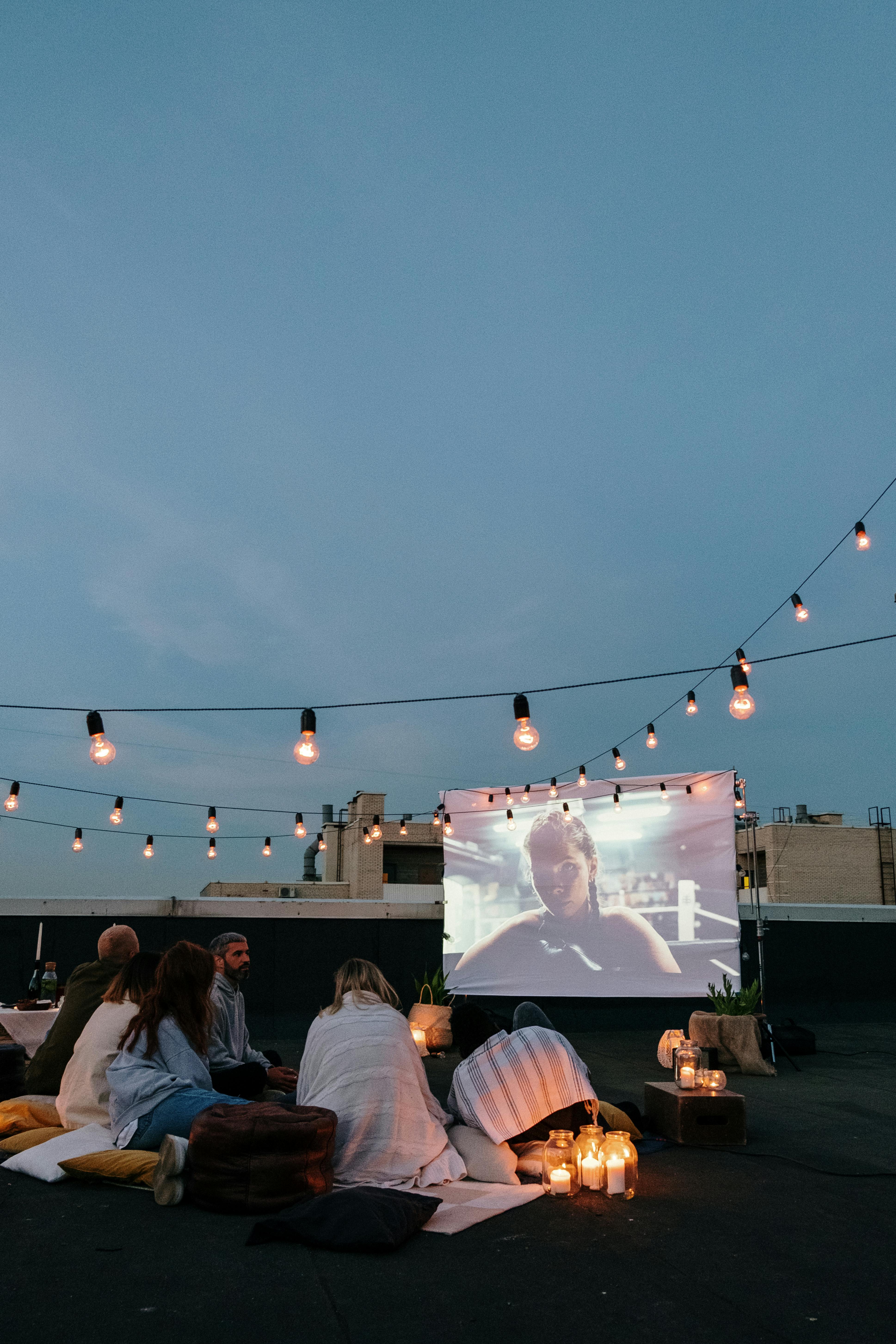 people watching a movie outdoors